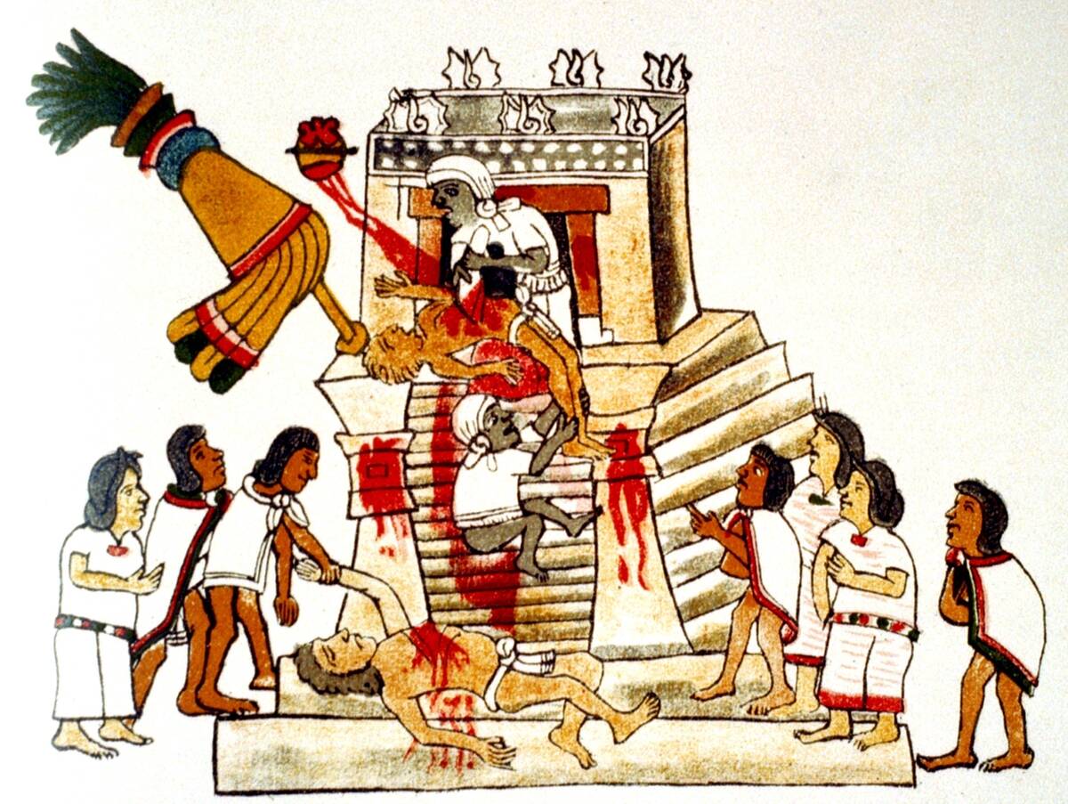 Priest offering the heart taken from a living human victim to the Aztec sun god and god of war, Huitzilopochtli. Print of facsimile from Aztec Codex, published 1904. Human Sacrifice...