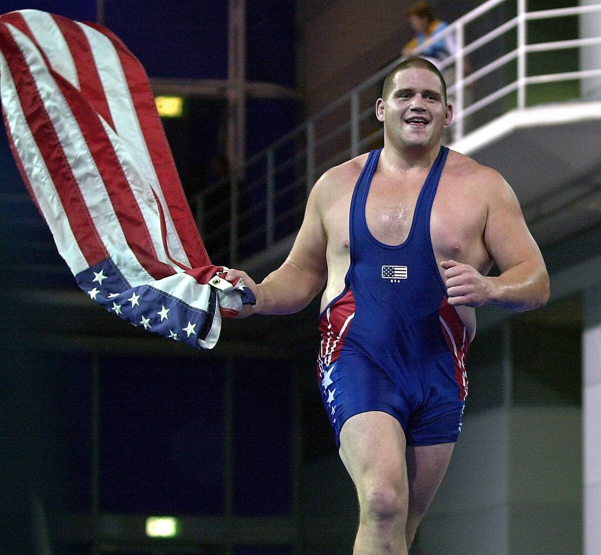 Rulon Gardner of the USA waves the Stars & Stripes