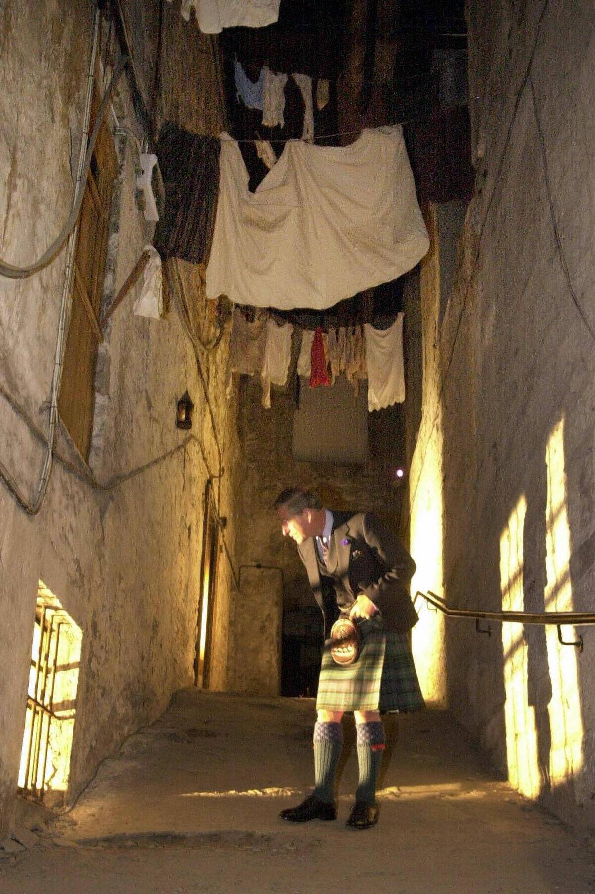 The Prince of Wales walks through and ex