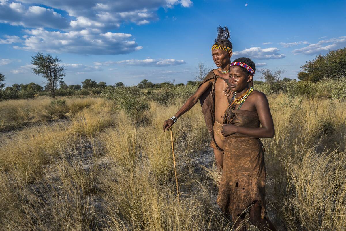 Two people look over the savanna in Botswana