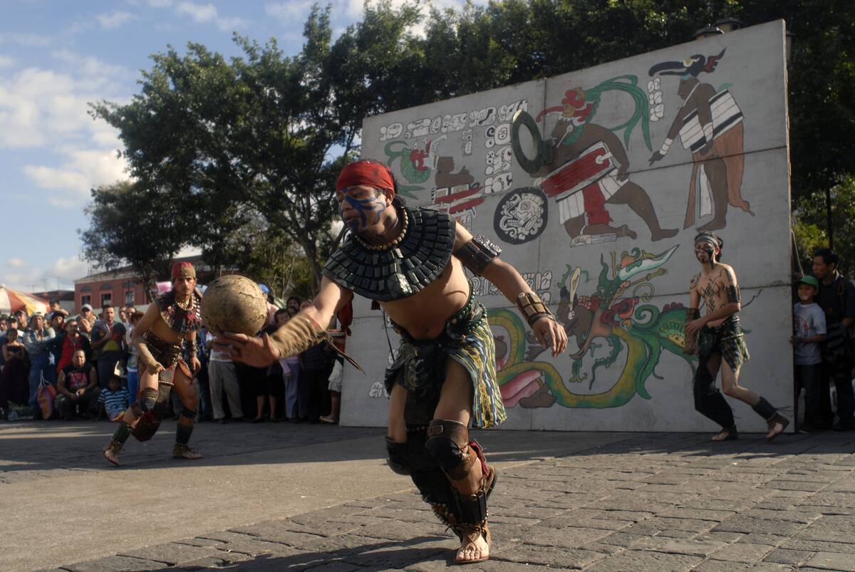 Men play a Mayan ball game, on December