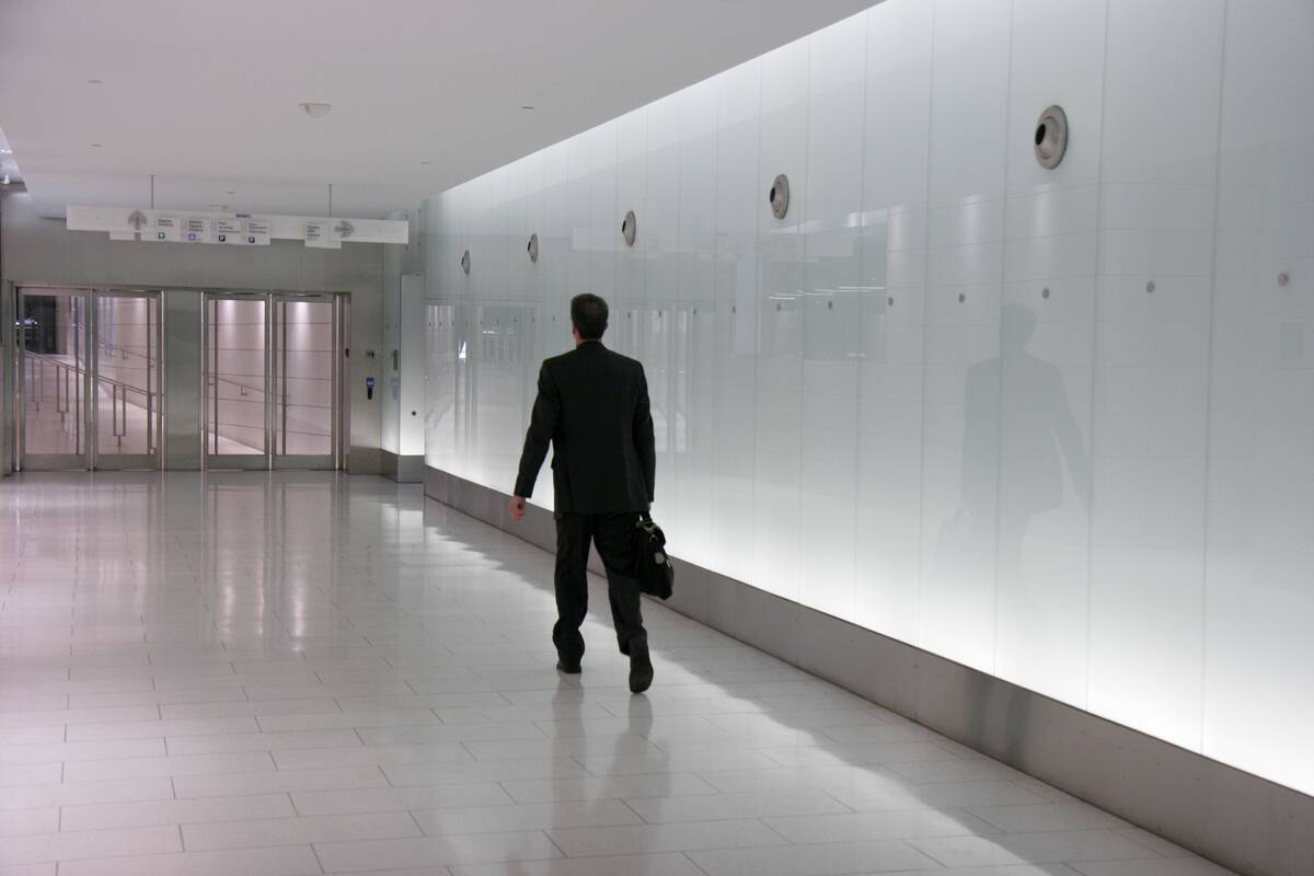 Montreal, RESO Underground City, businessman walking through tunnel