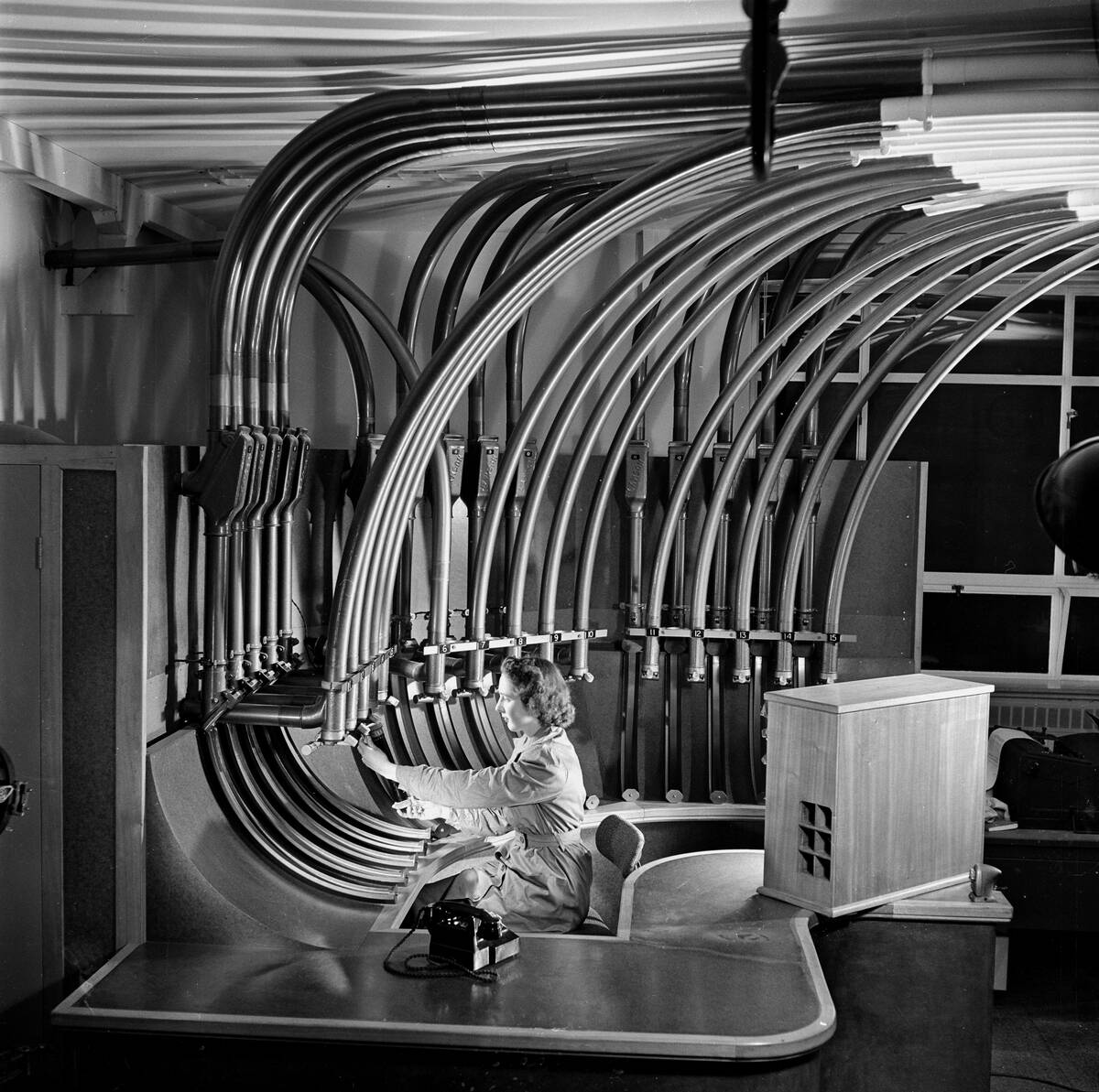 Secretary with pneumatic tube communications, Hull, 1954.