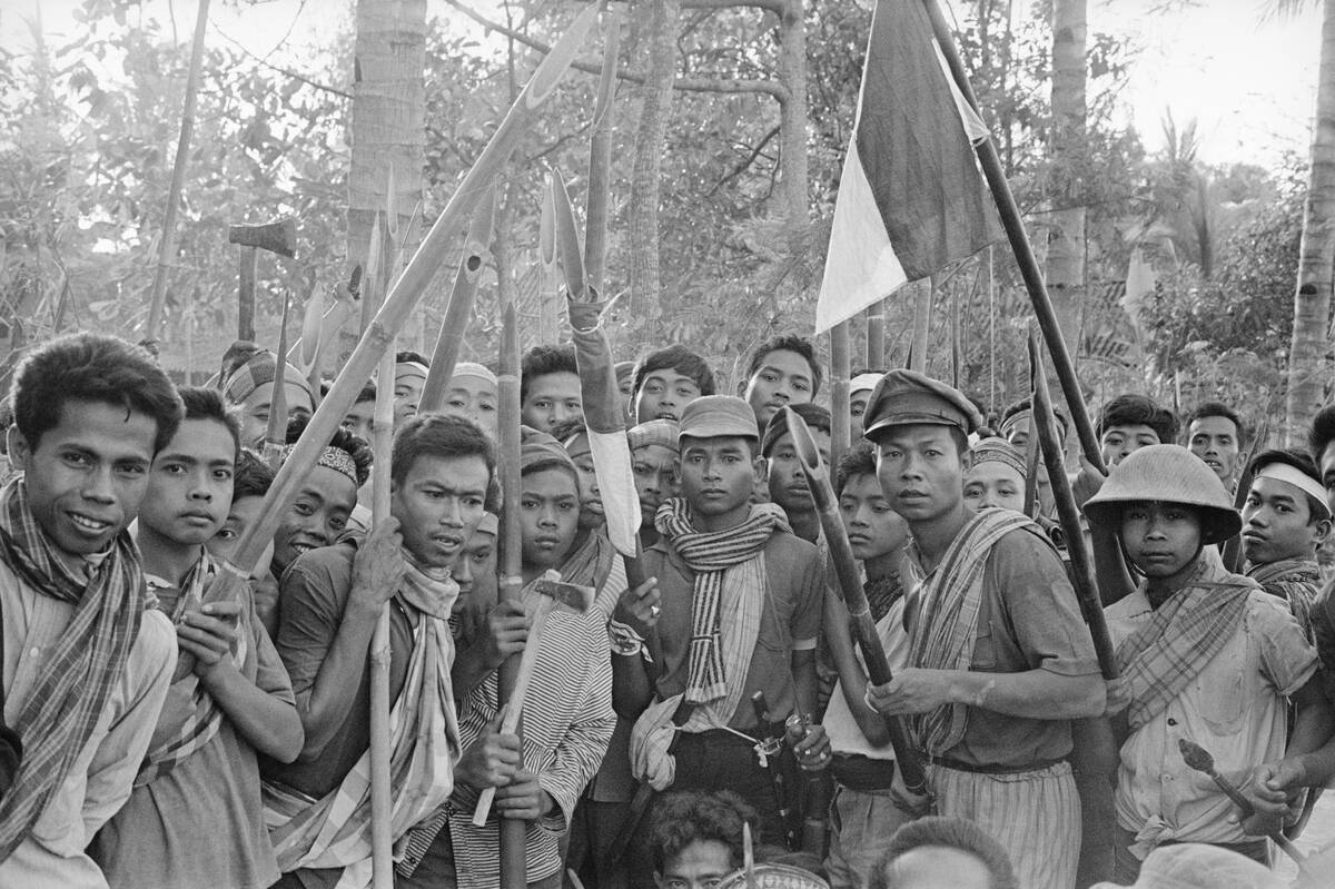 Young Indonesian Nationalists Carrying Bamboo Weapons