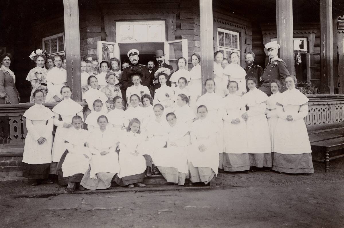 A Group Of Students From The Maiden Institute With Teachers On The Porch Of The Dacha