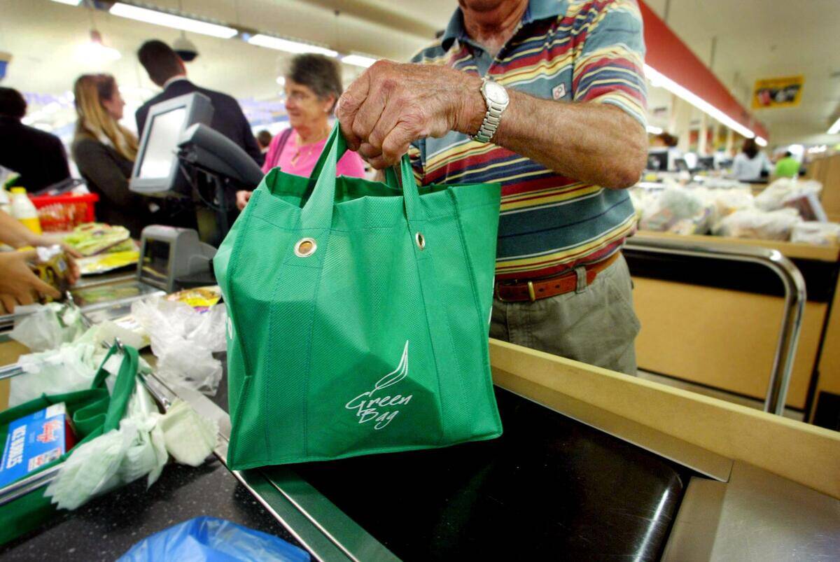 Australia's first 'Plastic Bag Free' checkout lanes as shoppers at Coles superma