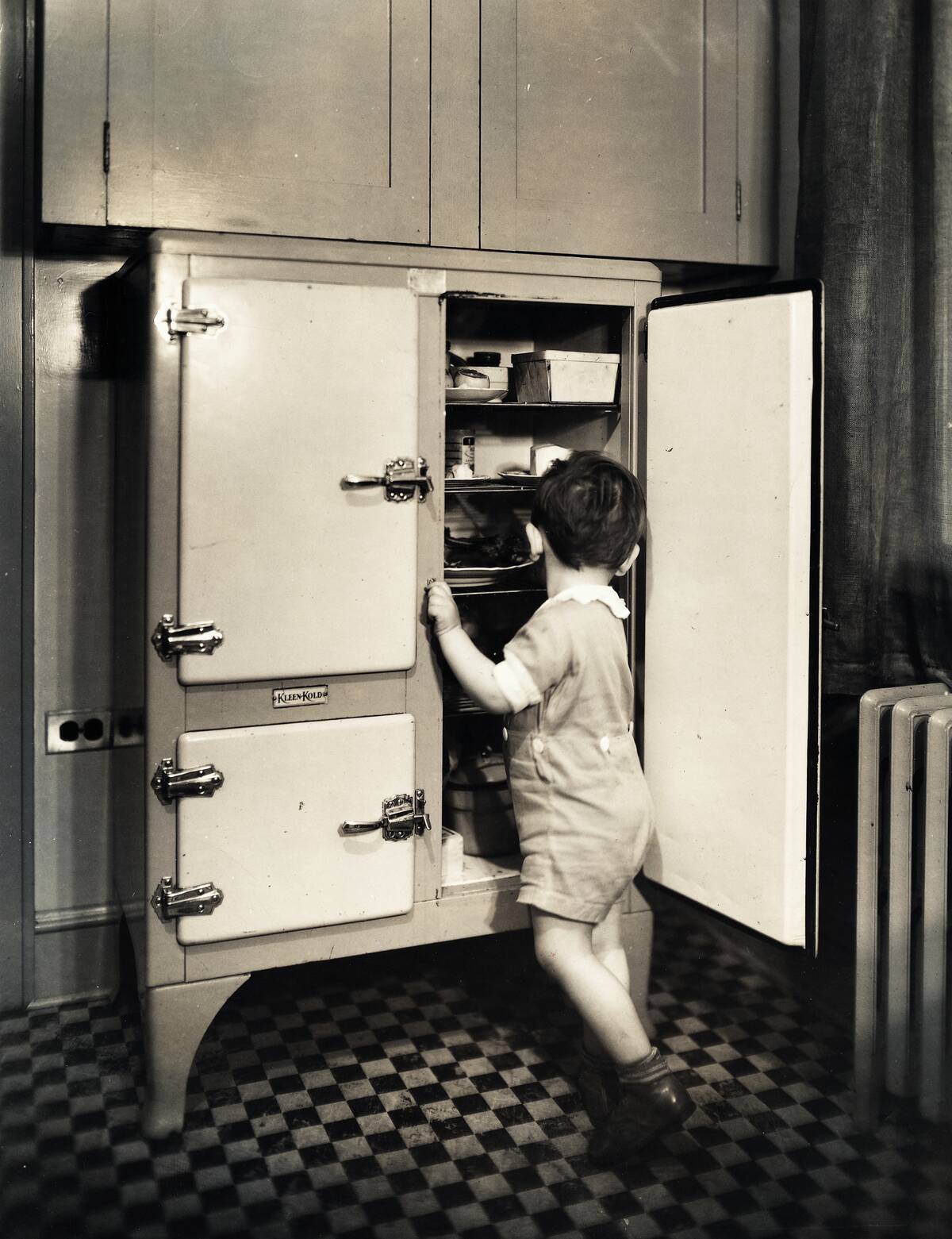 Child Reaching Into a Kleen-Kold Icebox