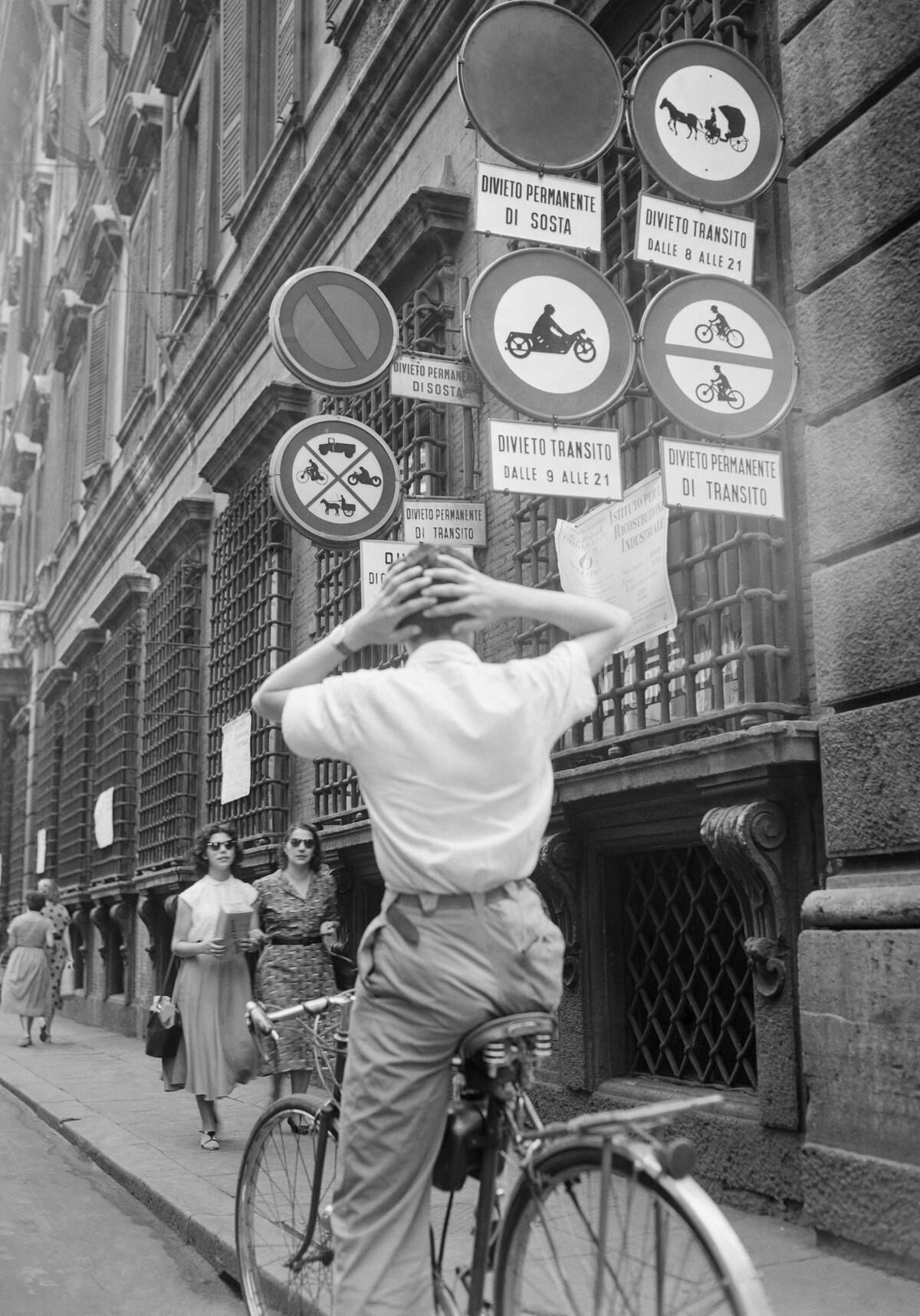 Cyclist Holding his Head