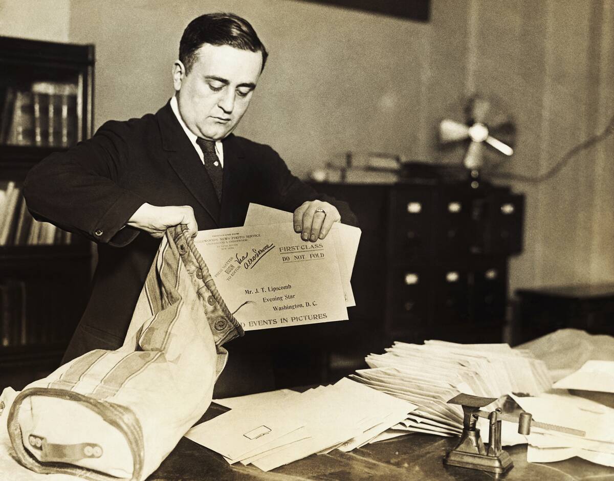 David Weissberg Putting Letters into a Mailbag