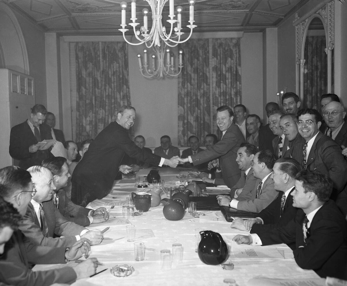 Ford and UAW Executives Shaking Hands