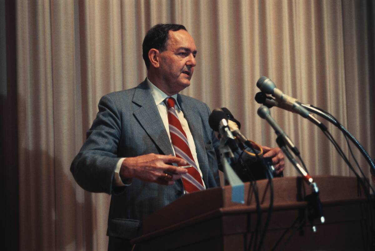 Herbert Simon Speaking at Podium
