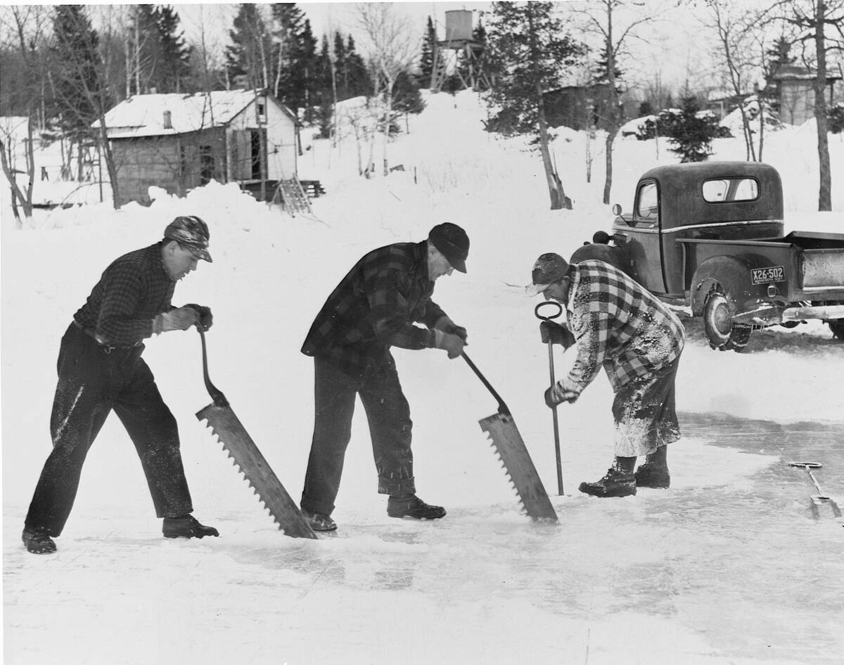 Men Cutting Ice on Lake