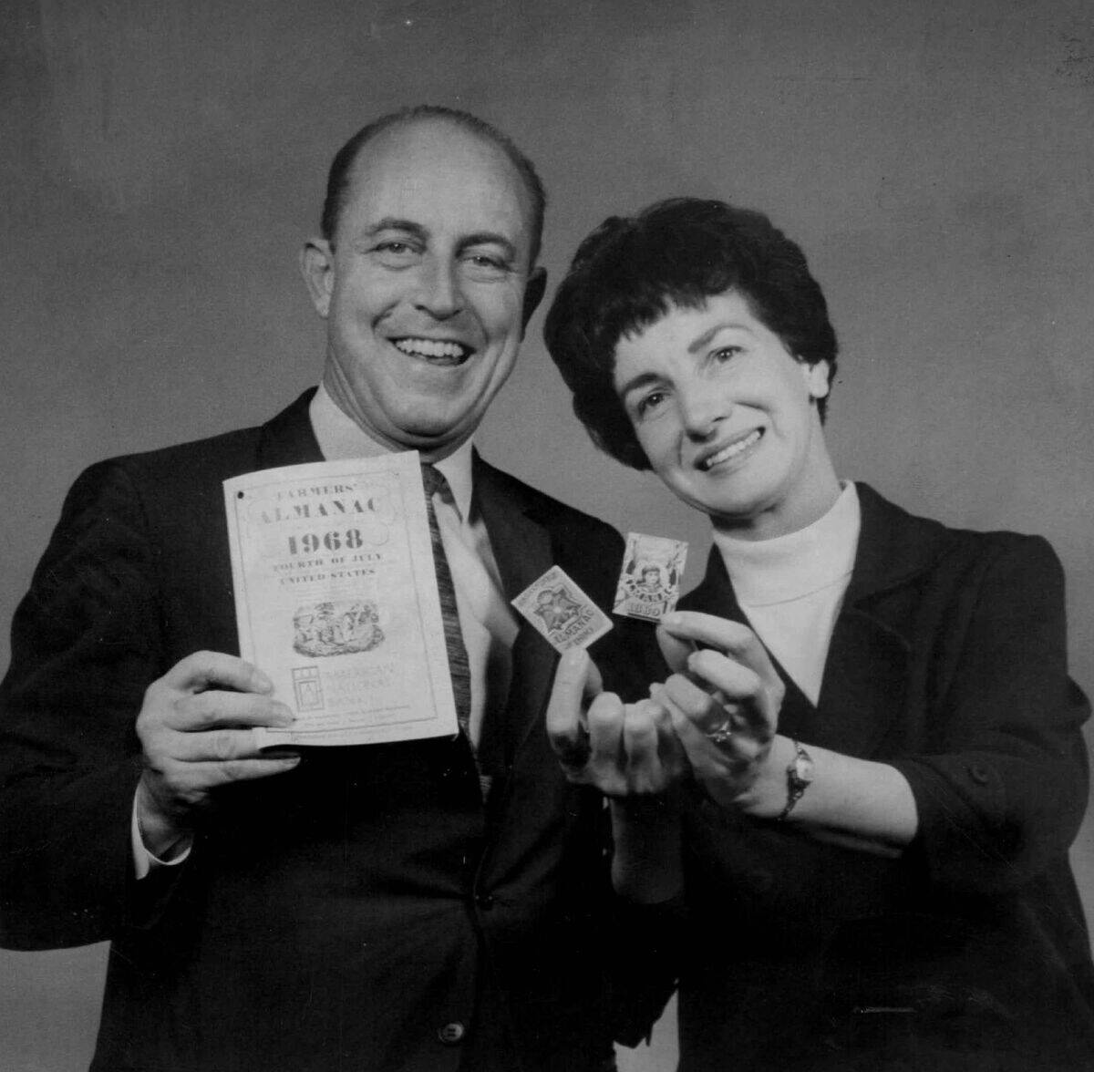 OCT 6 1967, OCT 8 1967; Mr. And Mrs. Ray Geiger With Almanacs; He's holding the latest edition of Fa