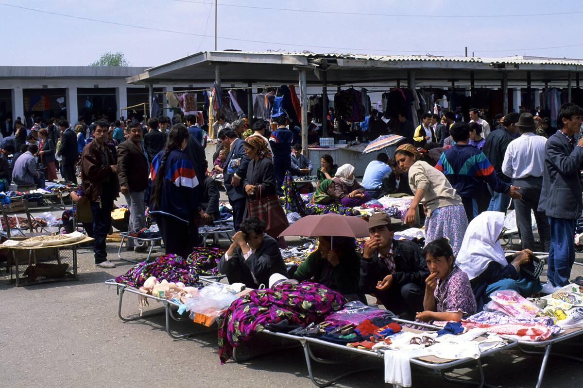 People selling goods at a market in Urganch, Uzbekistan