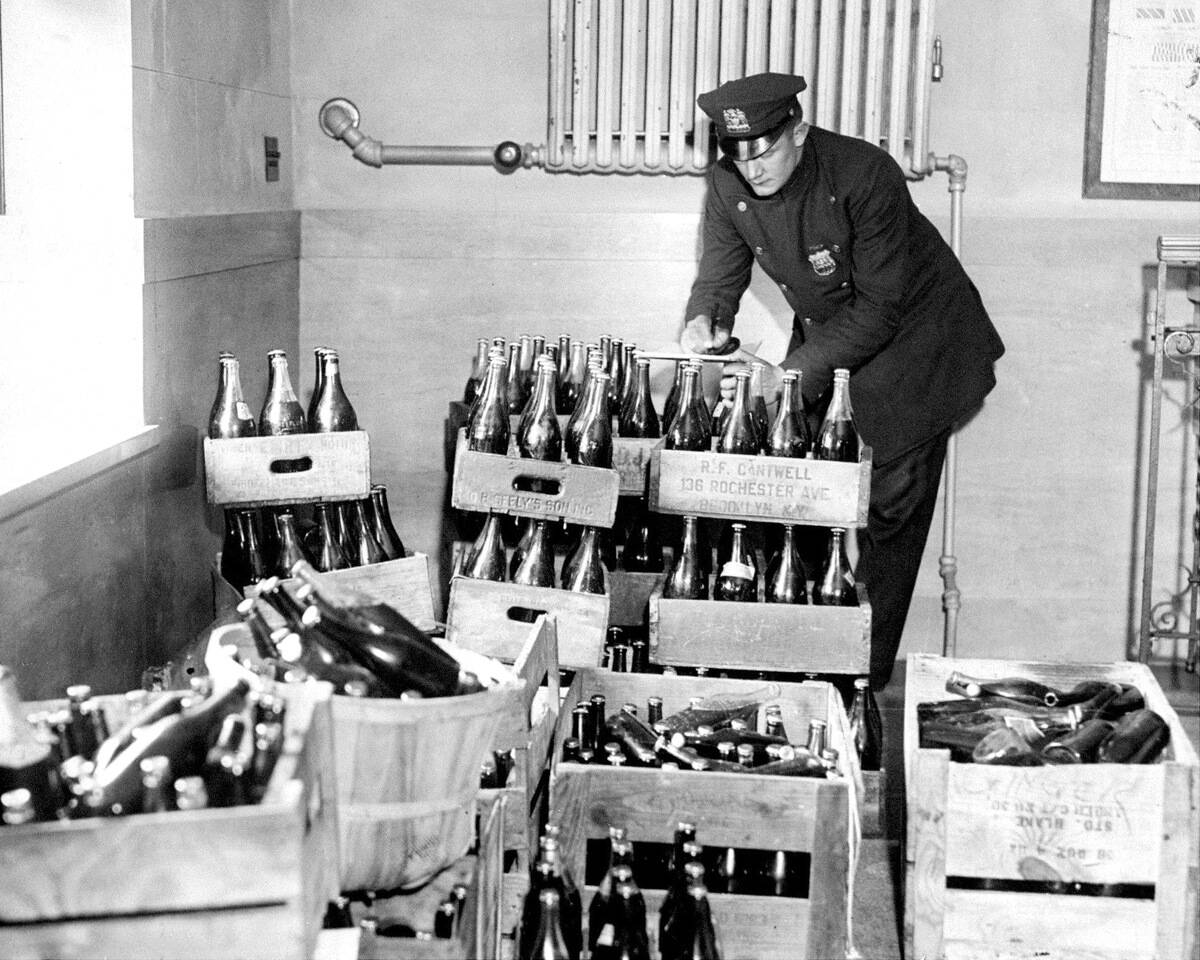 Police Officer C. Beckman checks out 450 bottles of confisca