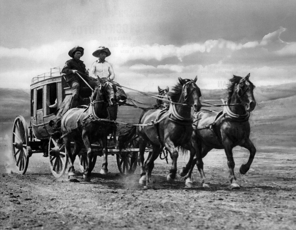 Western stagecoach with two horses and two drivers