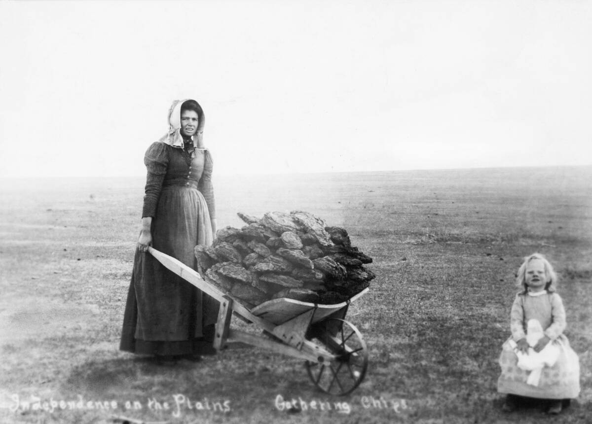 Woman and Daughter Gathering Buffalo Chips