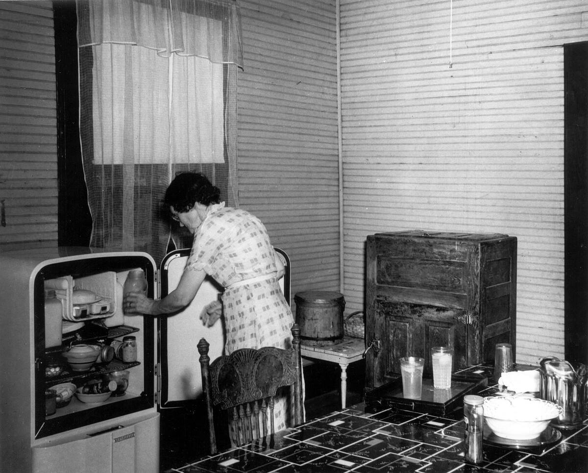 Woman Using Fridge