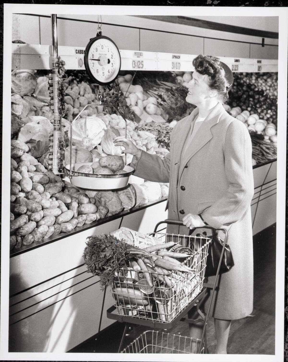 Woman Weighing Potatoes in Grocery Store