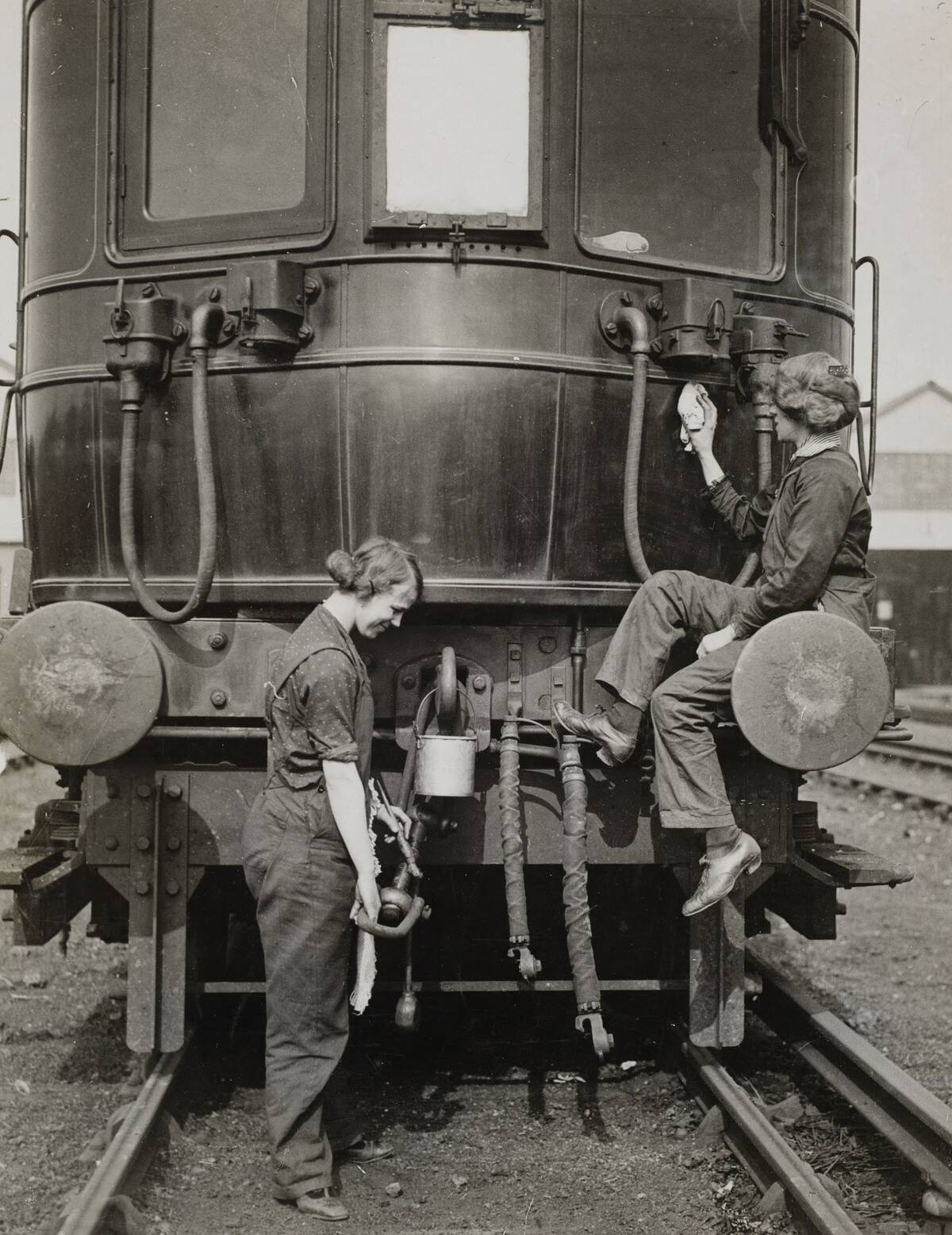 Women carriage cleaners, London & South Western Railway, WWI, c 1916.