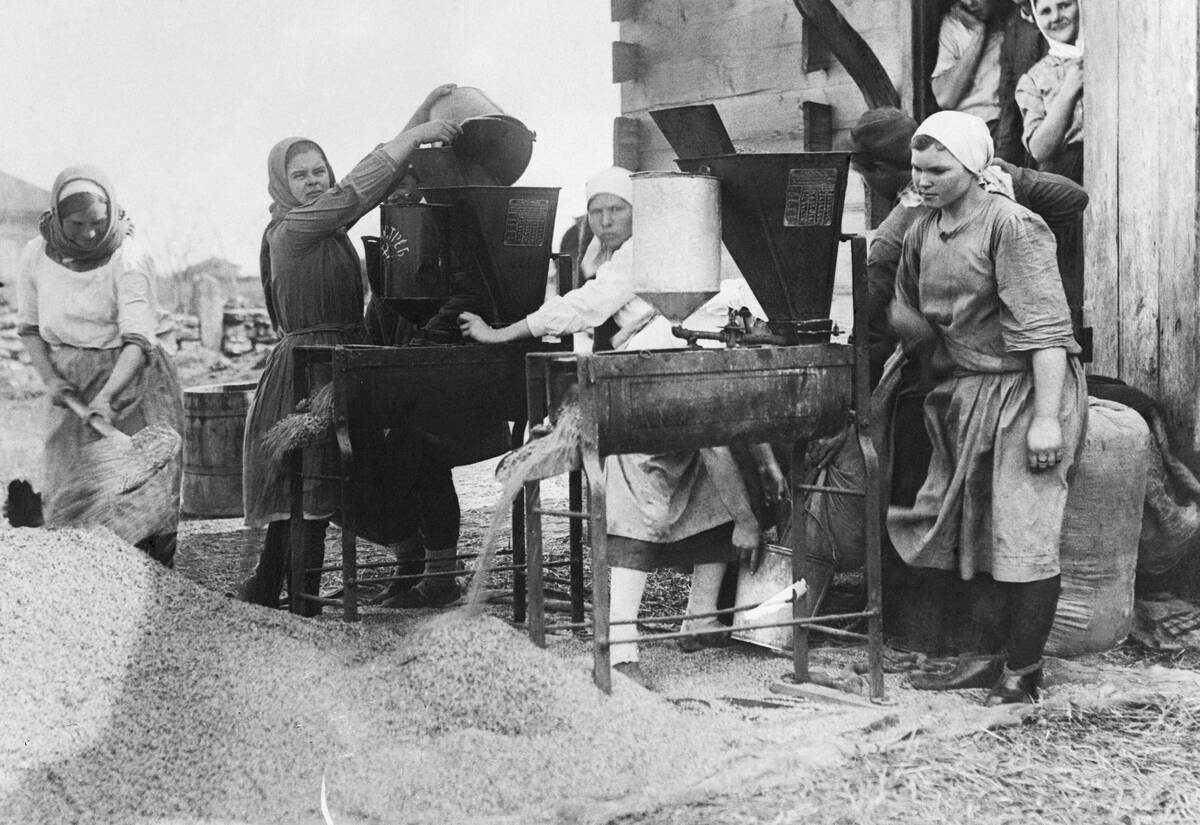 Women Use Modern Machinery to Clean Grain