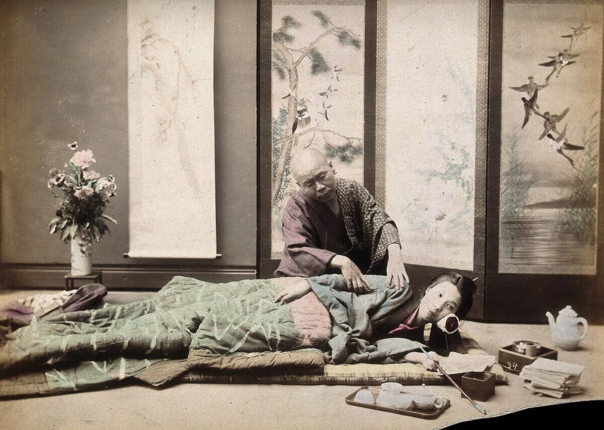 A Japanese Woman Being Massaged By A Blind Japanese Masseur