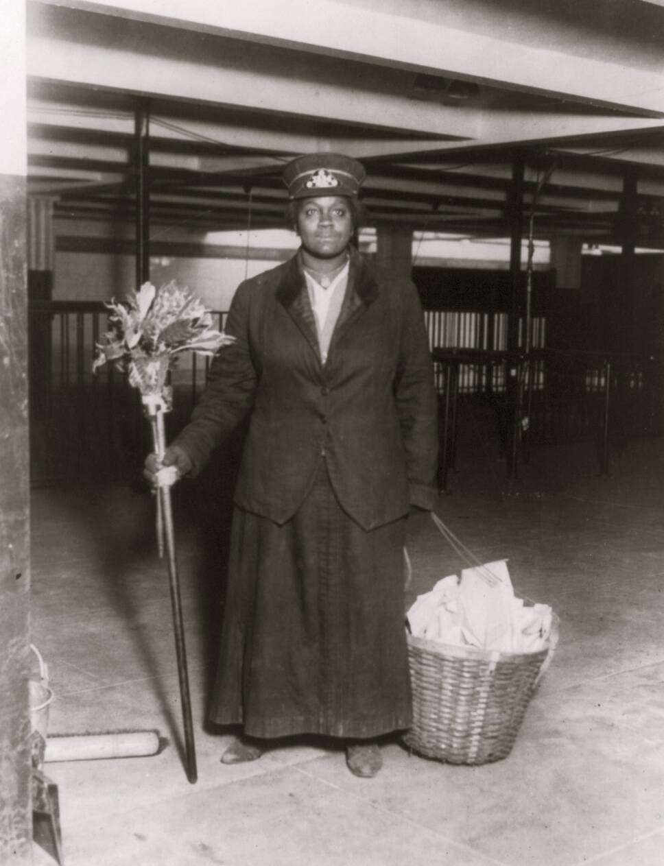African American porter posed with cleaning gear
