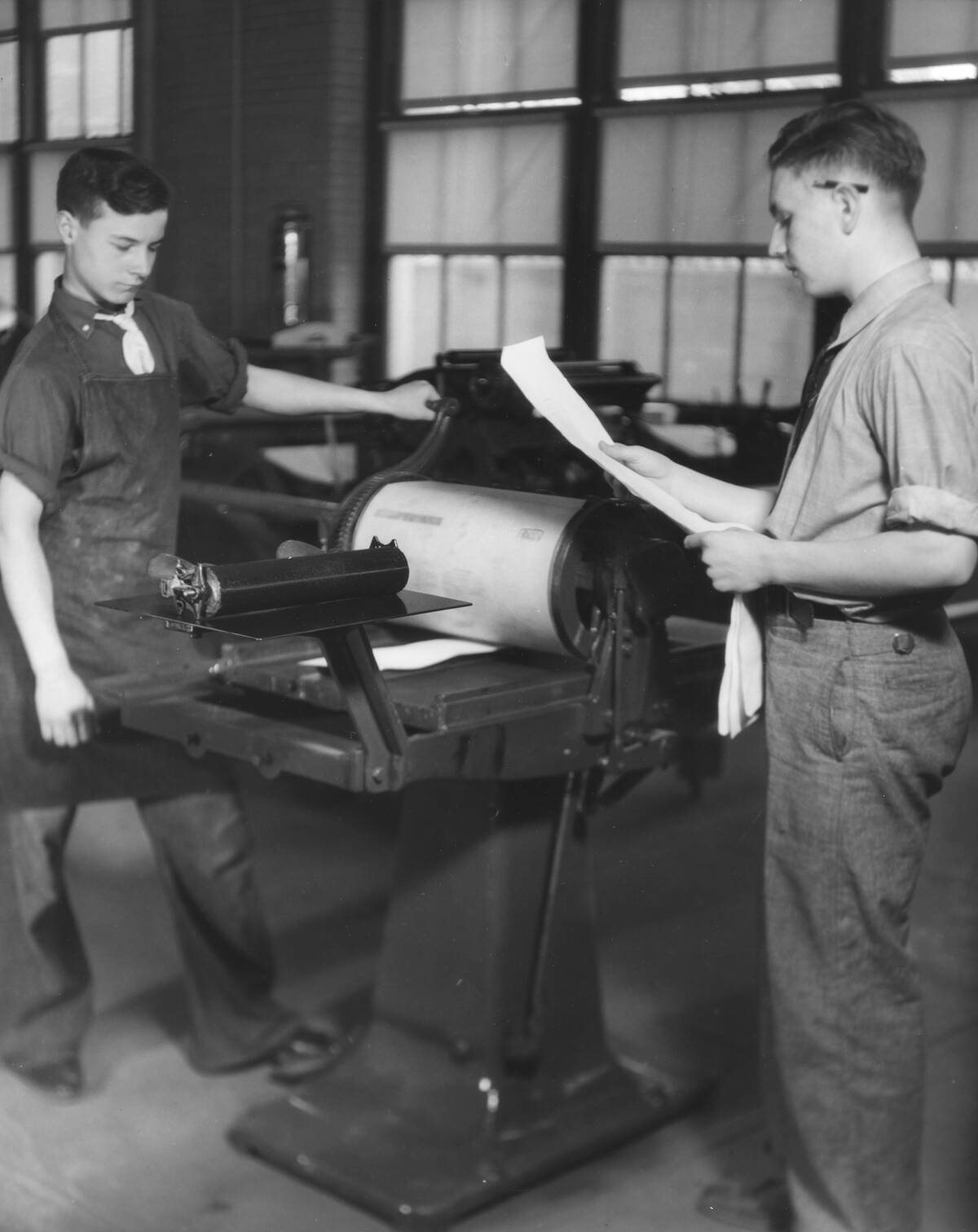 High School Students Working On Printing Press