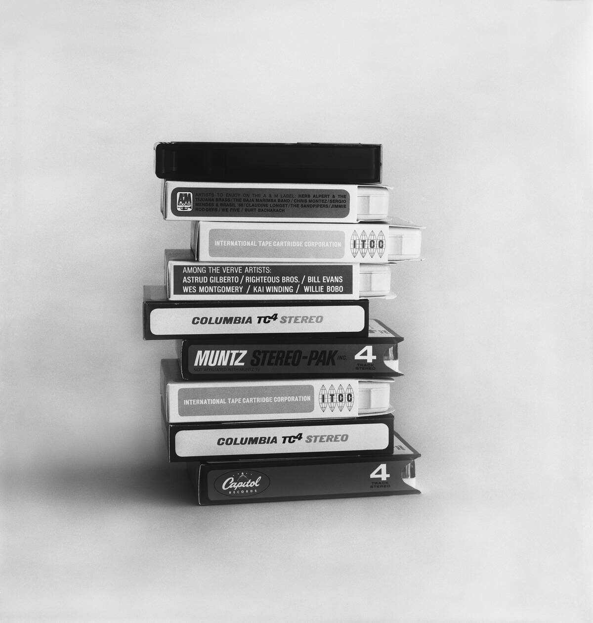 Stack of cassette tapes against white background, close-up