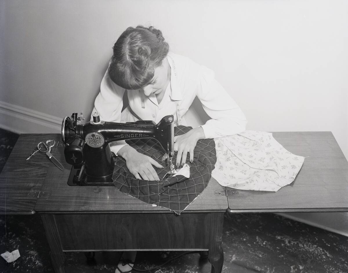 Woman Working On Sewing Machine