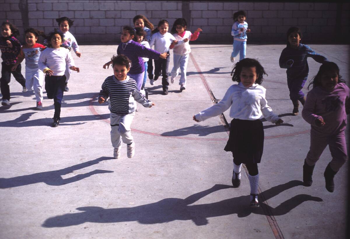 Boys & Girls Run In The Schoolyard