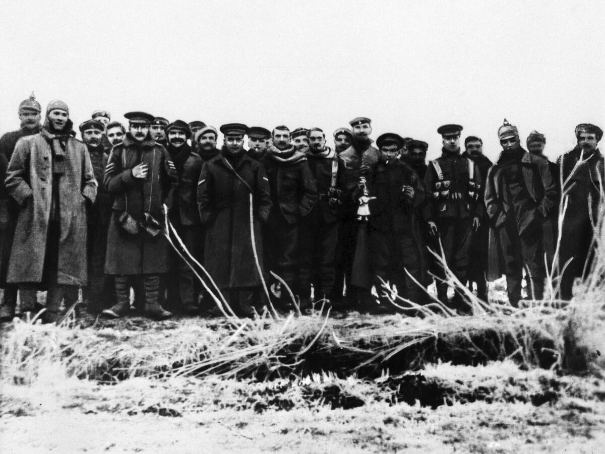 British and German troops hold a temporary truce on Christmas Day 1914 during World War One