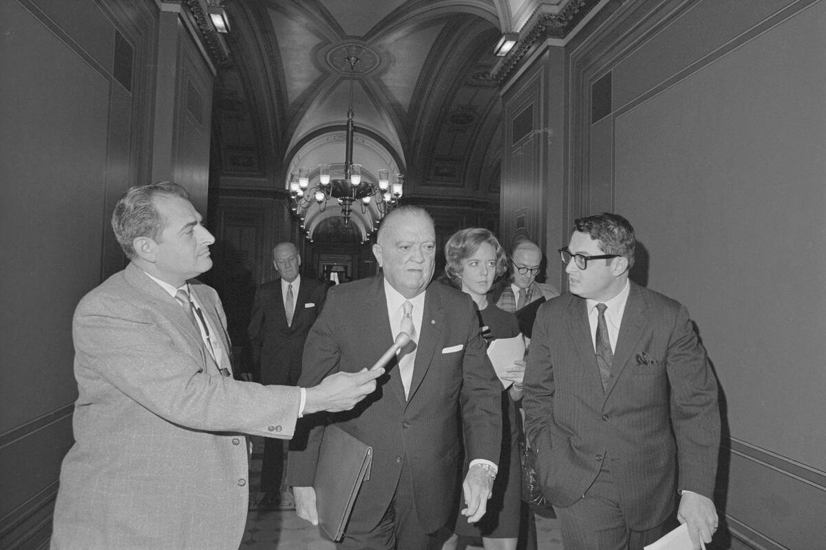 F.B.I. Director J. Edgar Hoover Passing Reporter