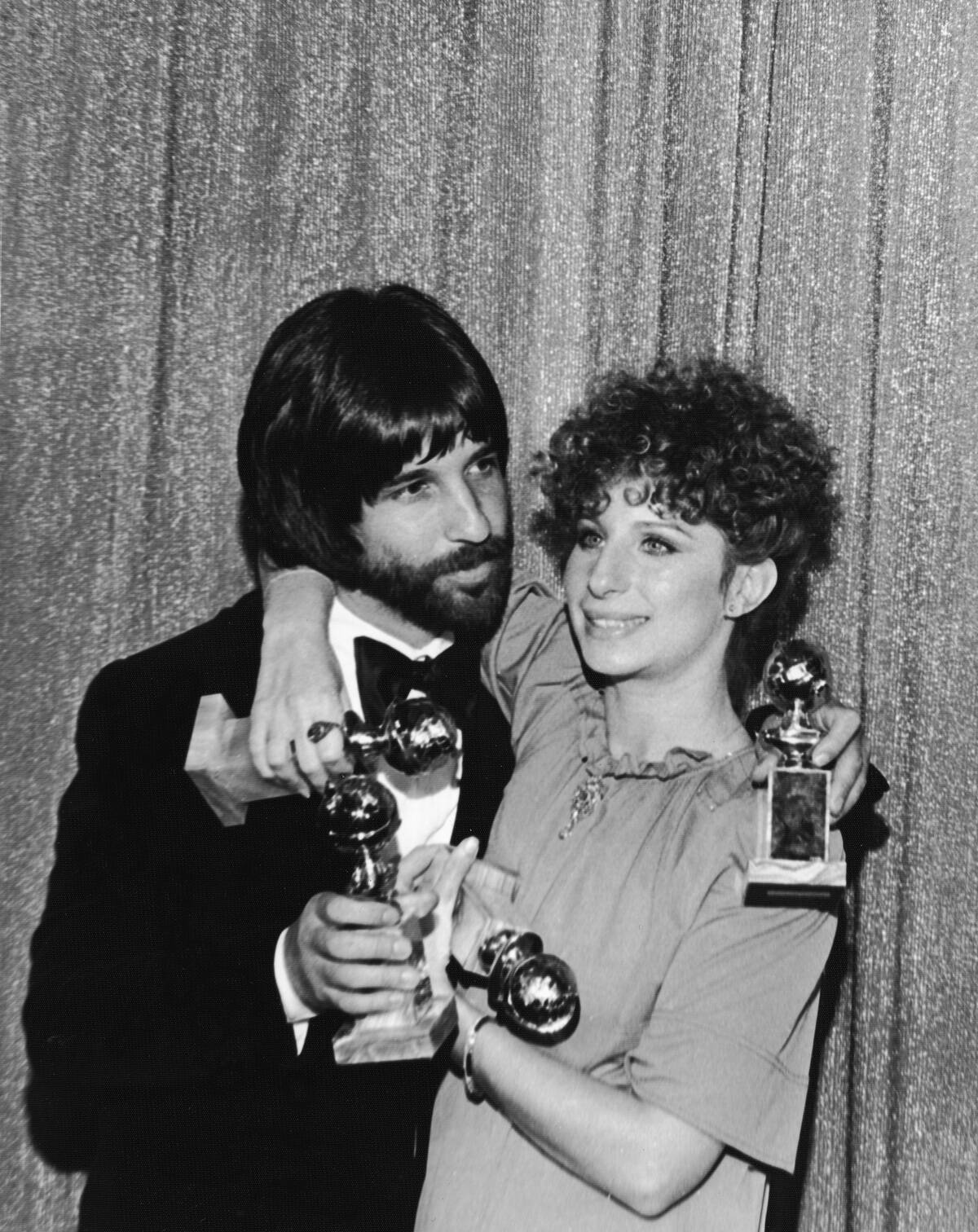 Jon Peters & Barbra Streisand Hold Golden Globes
