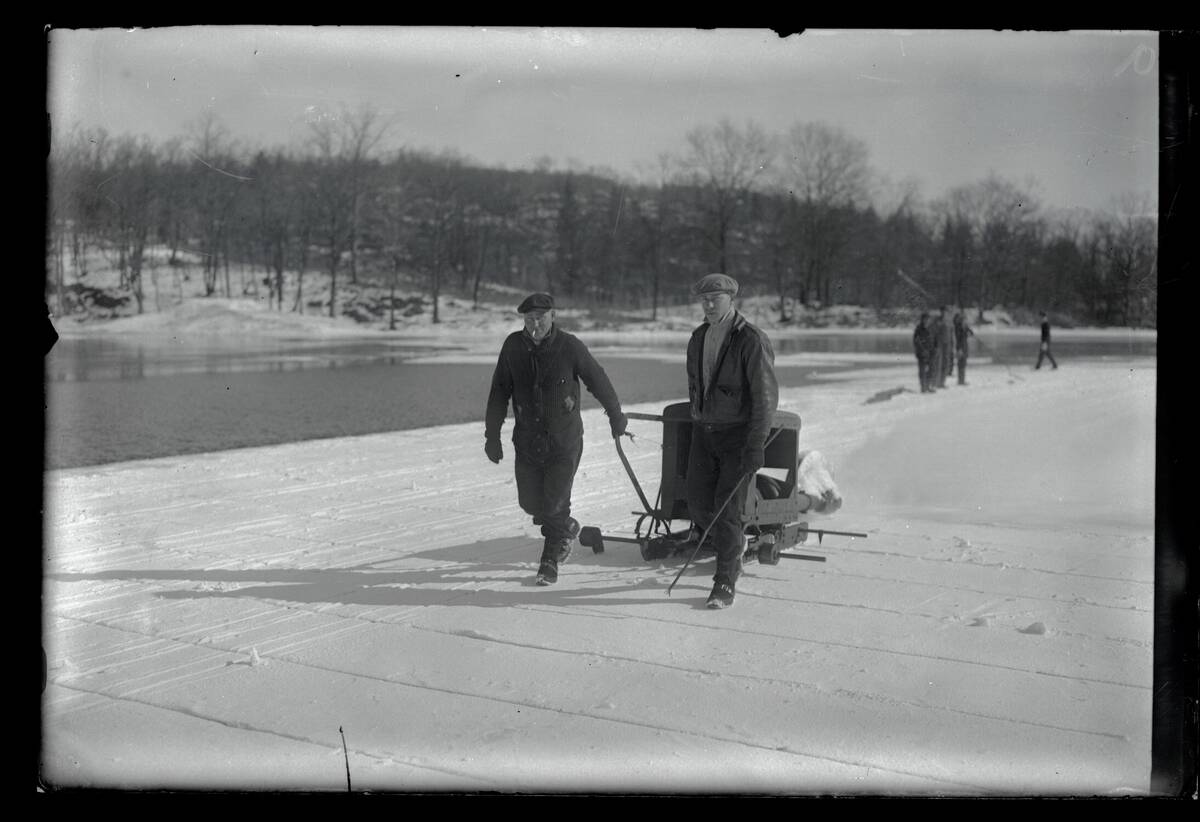 Men Cutting Ice into Cakes