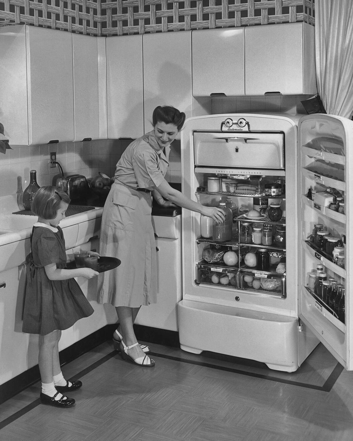 Mother And Daughter In The Kitchen