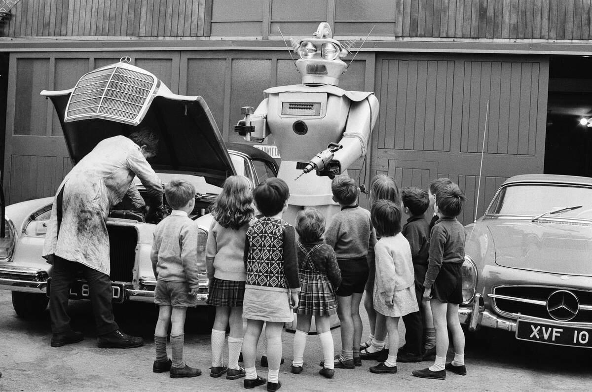 Robot assisting garage mechanics 1968