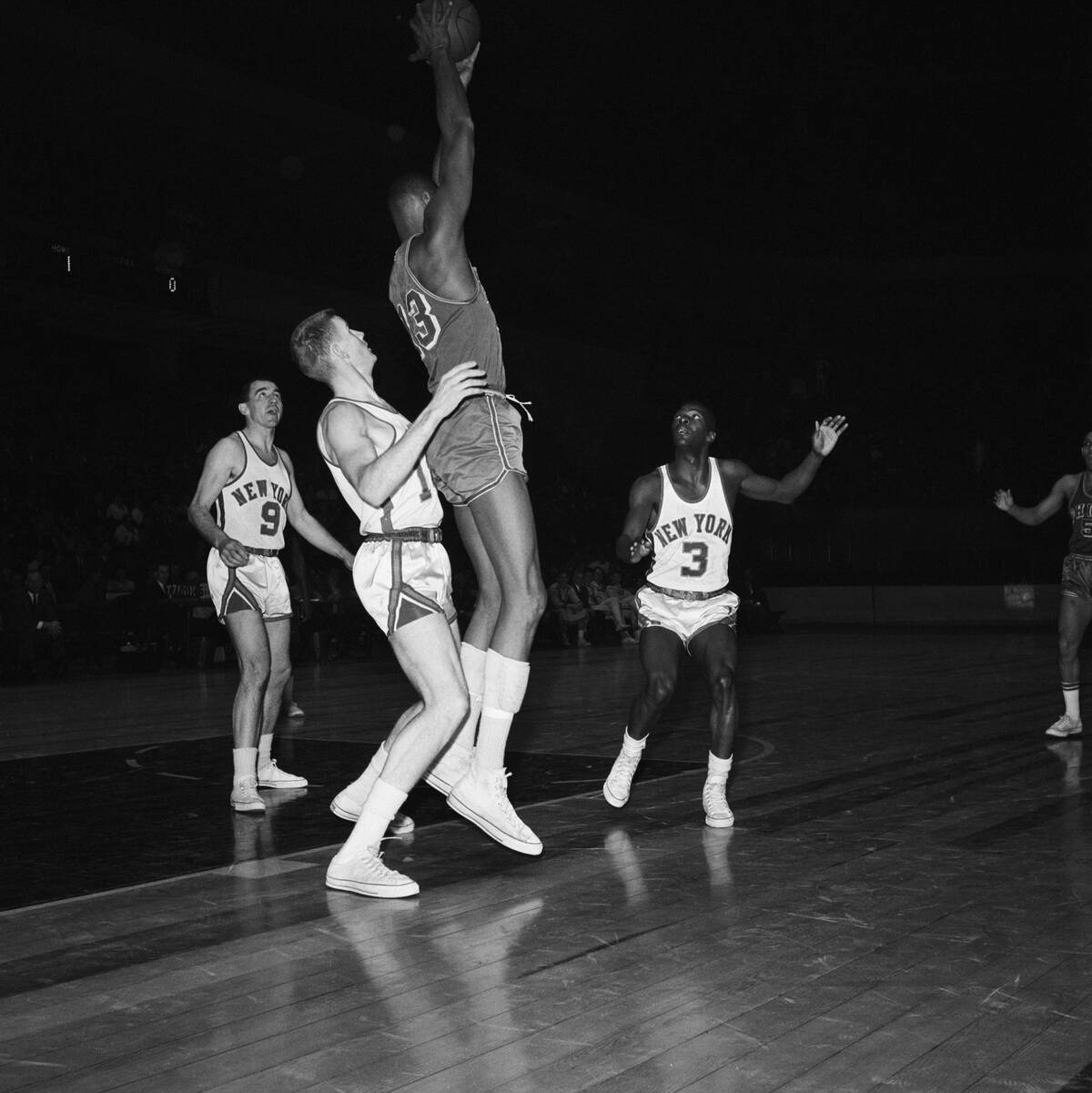 Wilt Chamberlain Jumping Holding Ball