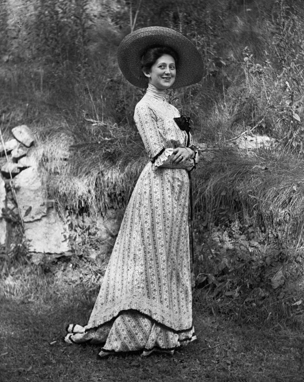Young Lady Wearing Brimmed Straw Hat