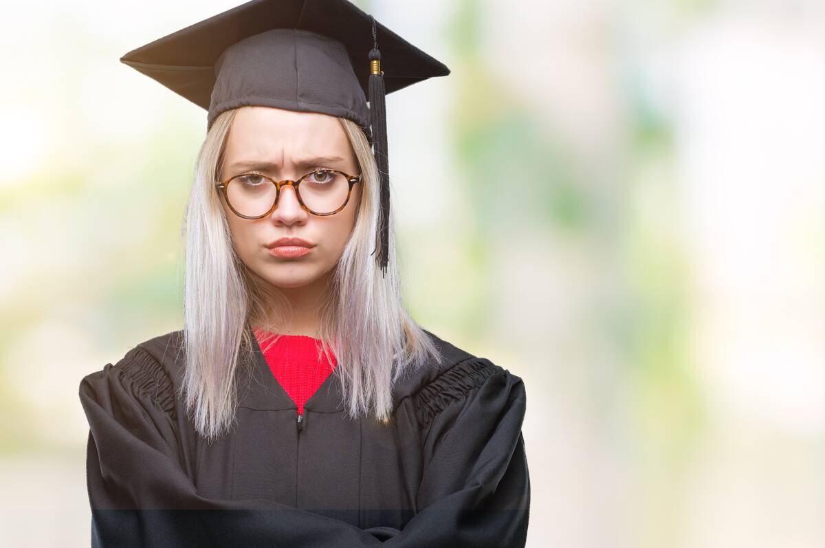 annoyed-graduate-in-cap-and-gown-portrait-2026-03-26-01-08-54-utc