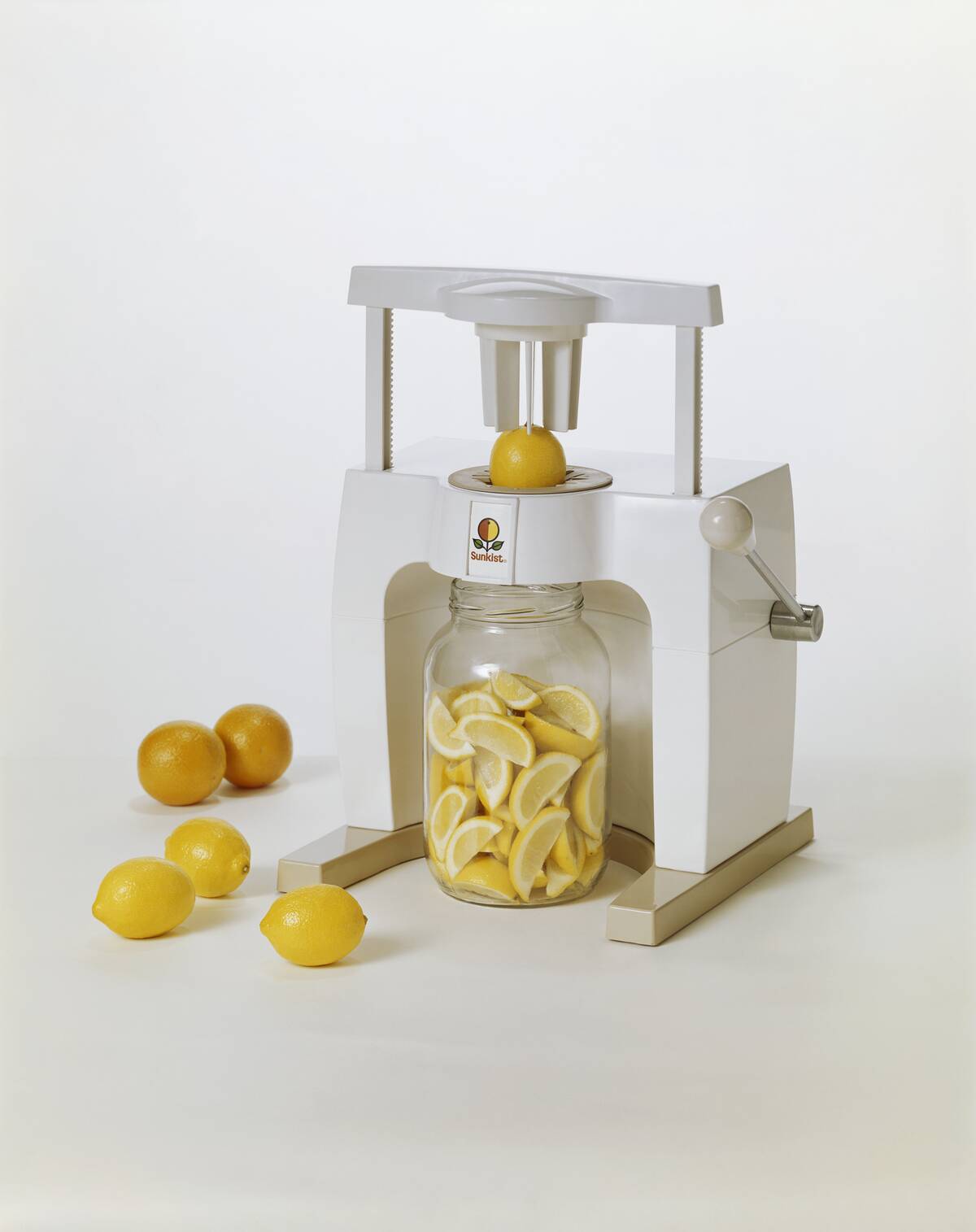 Lemon being sliced by food processor