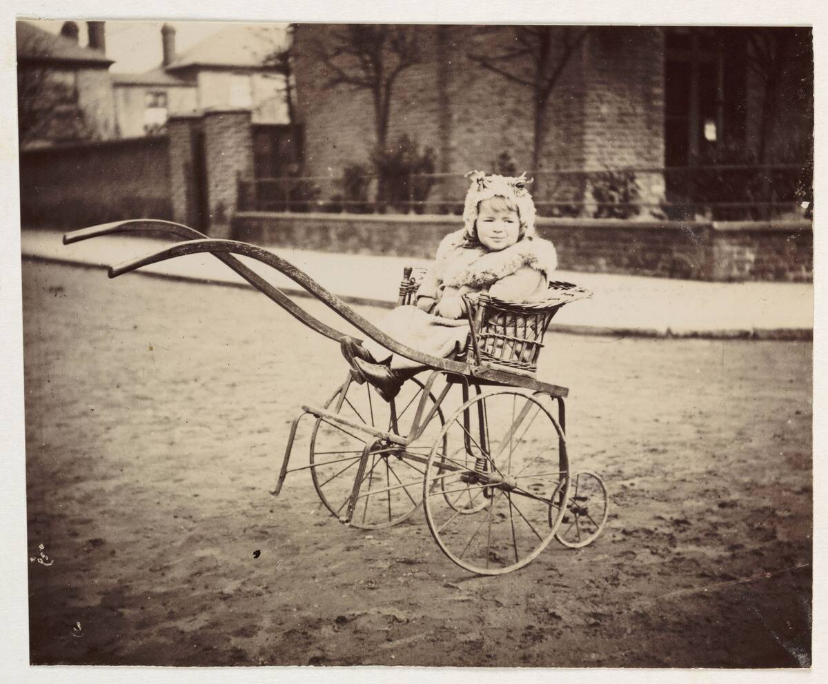 Little girl in a pram, c 1897.