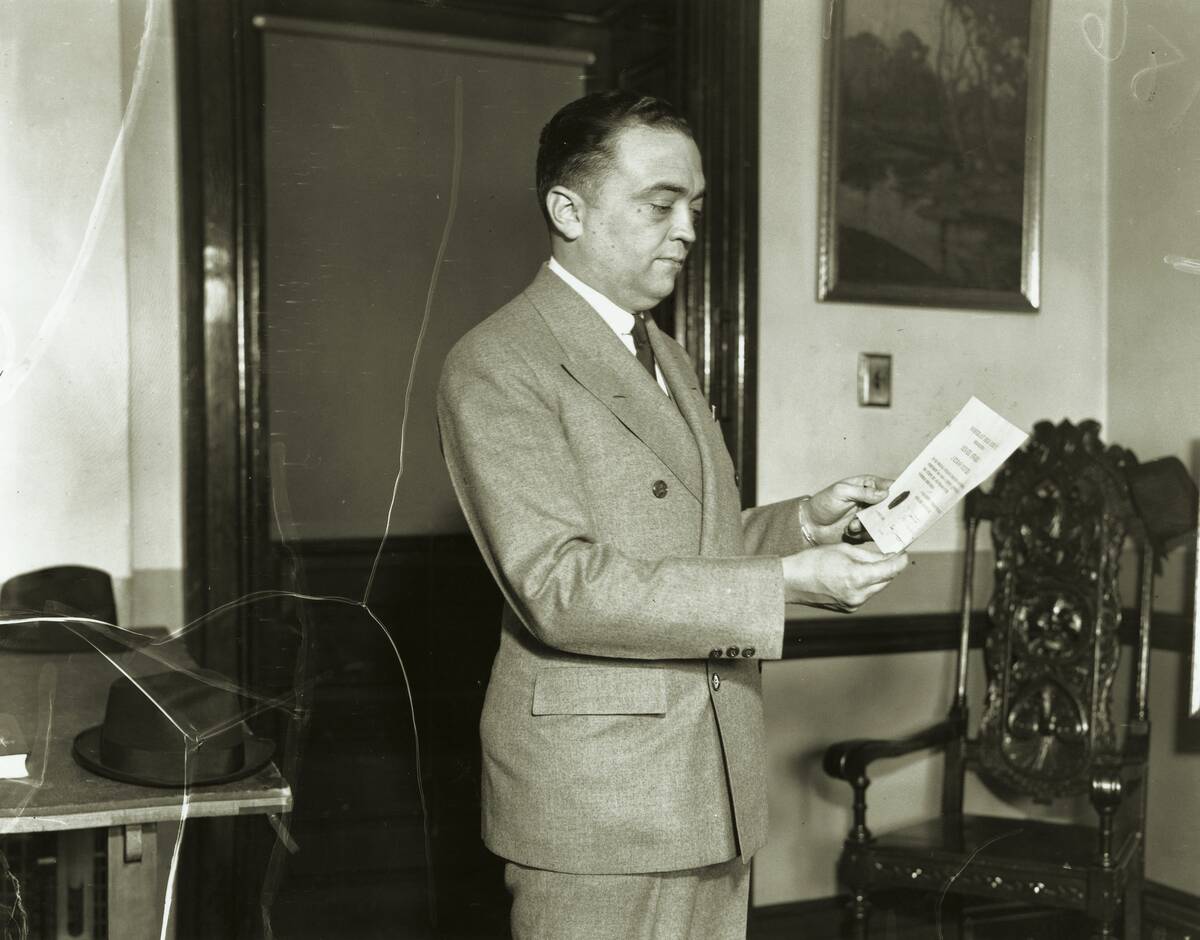 J. Edgar Hoover holding the Senate award which he received on May 21, 1936.