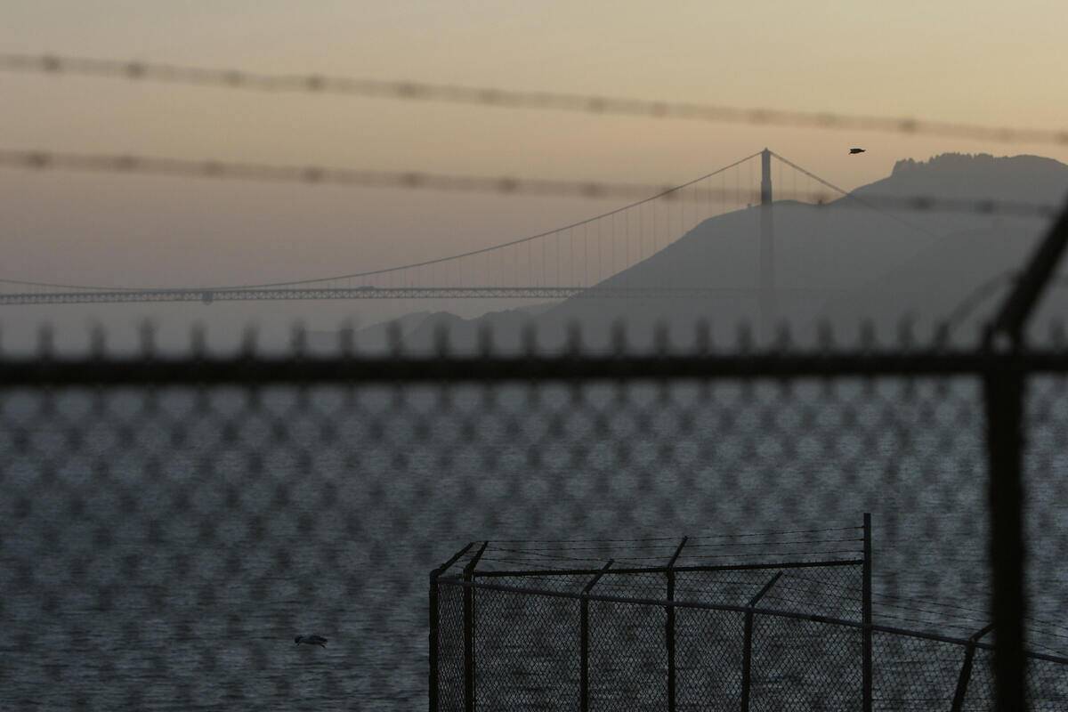 The Golden Gate Bridge is visible throug