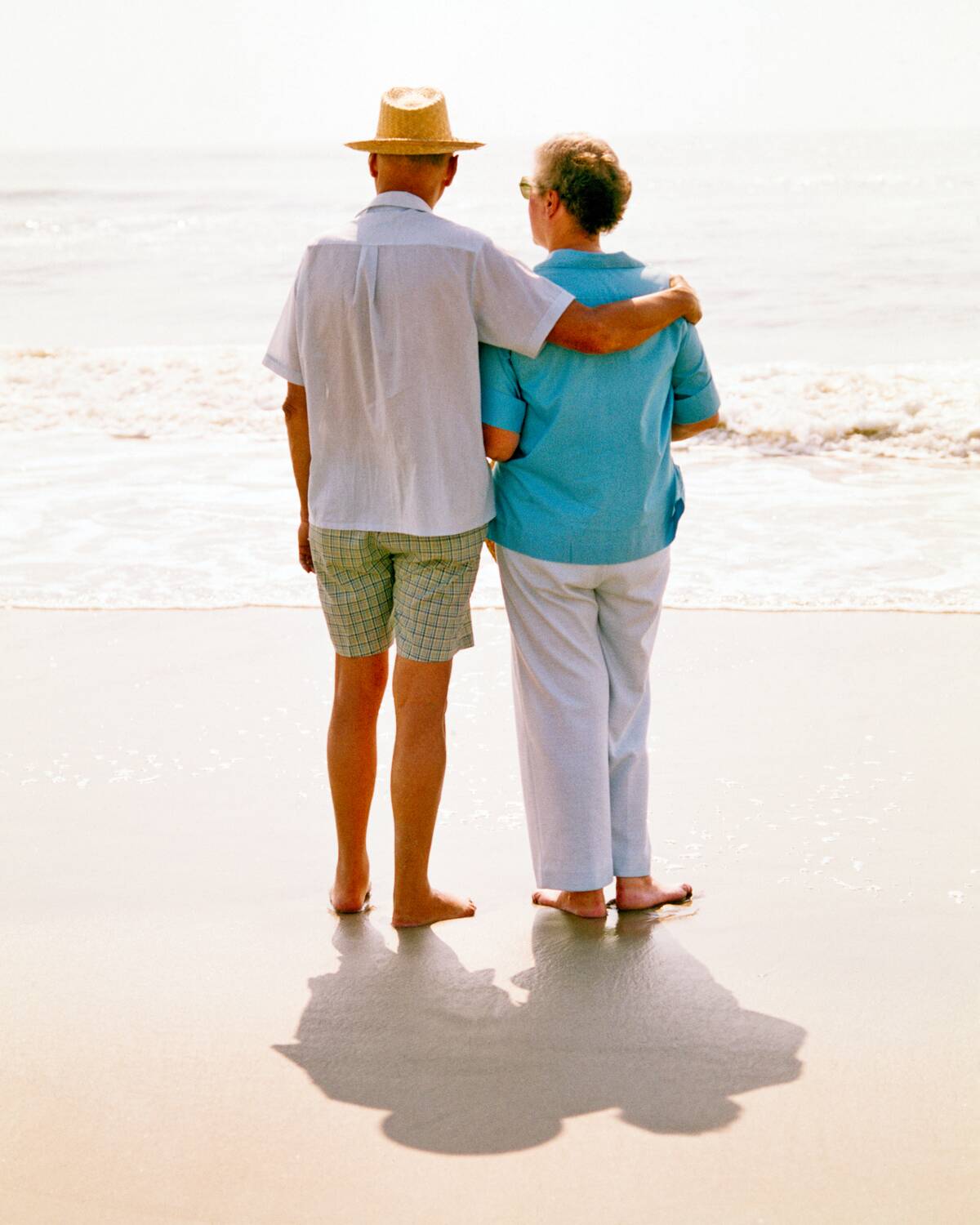 1970s Senior Couple Walking...