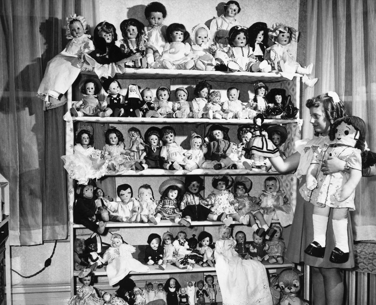 A Girl with her Doll Collection