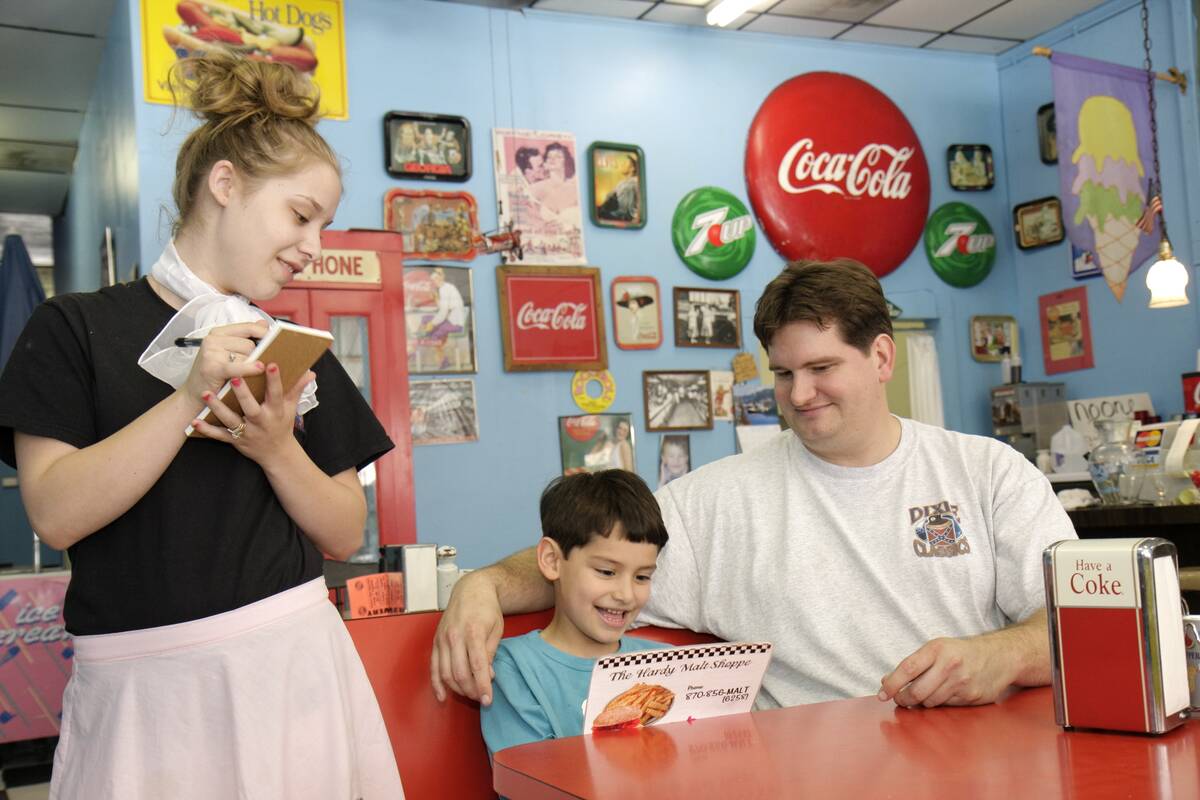A waitress taking order in the Hardy Malt Shoppe.