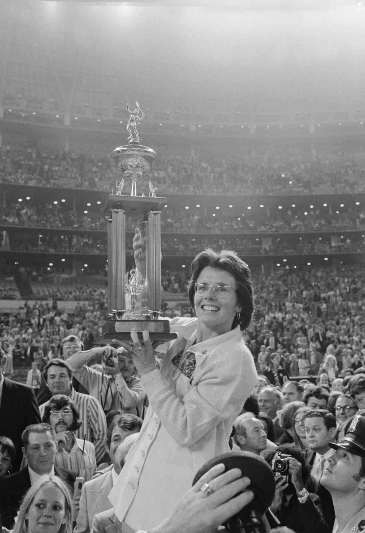 Billie Jean King Holding Trophy