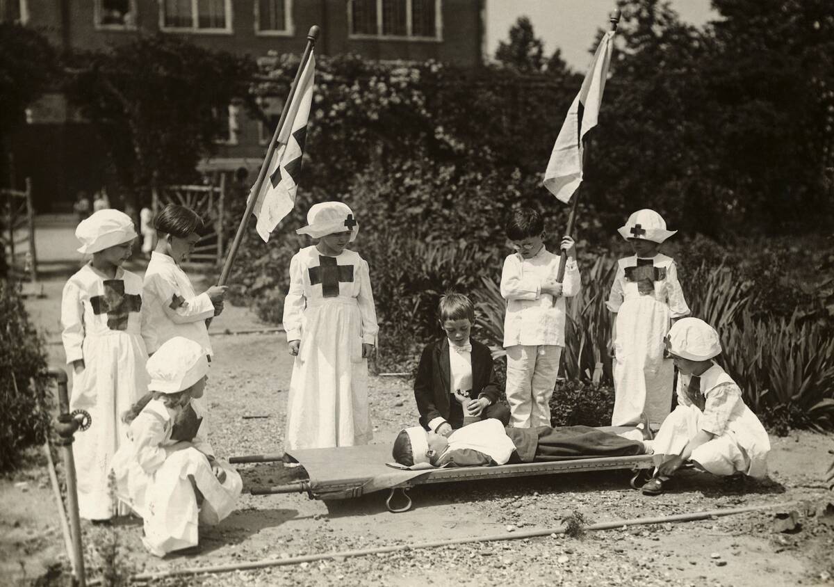 Children Staging Red Cross First Aid Drill During World War I