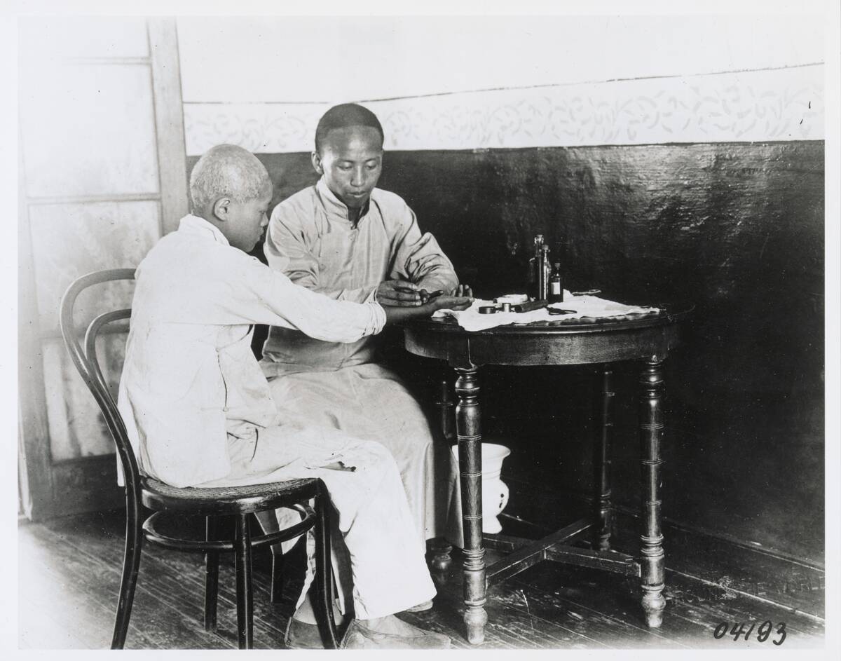 Chinese Doctor with Patient